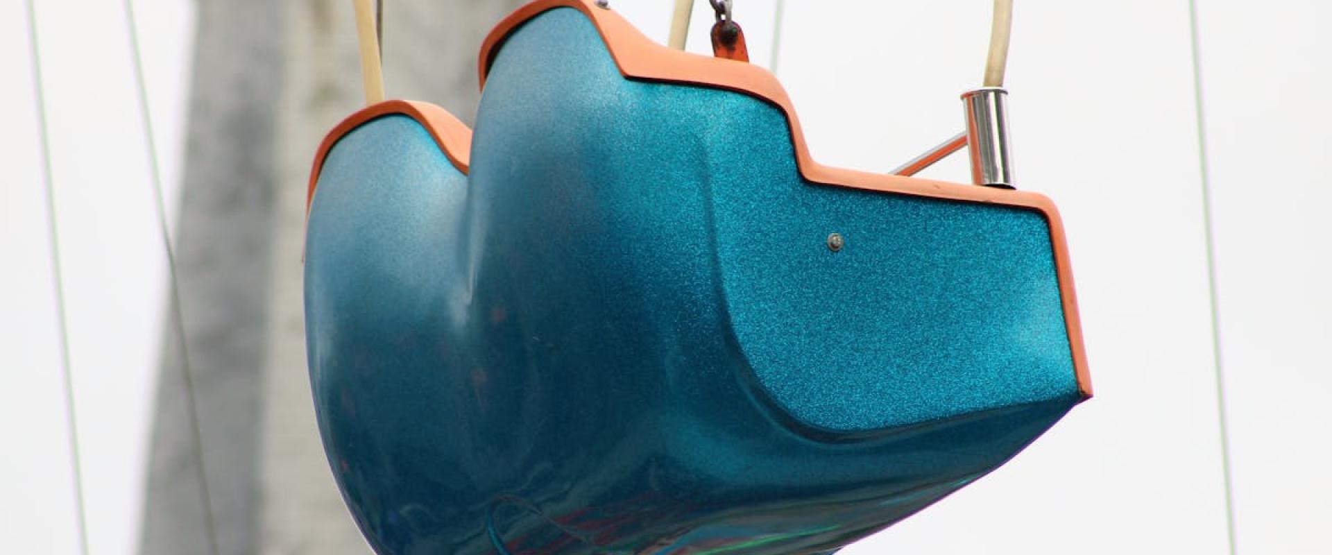Close-up of a colorful swing ride at a Dutch amusement park, focusing on vibrant design.