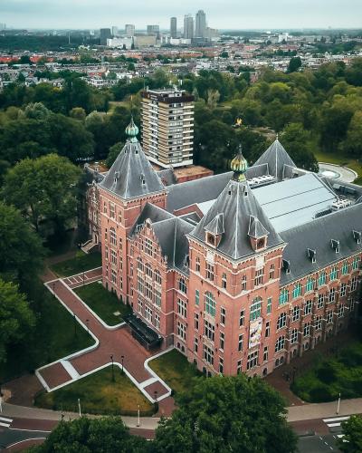 Aerial shot showcasing the neoclassical architecture in Amsterdam's lush surroundings.