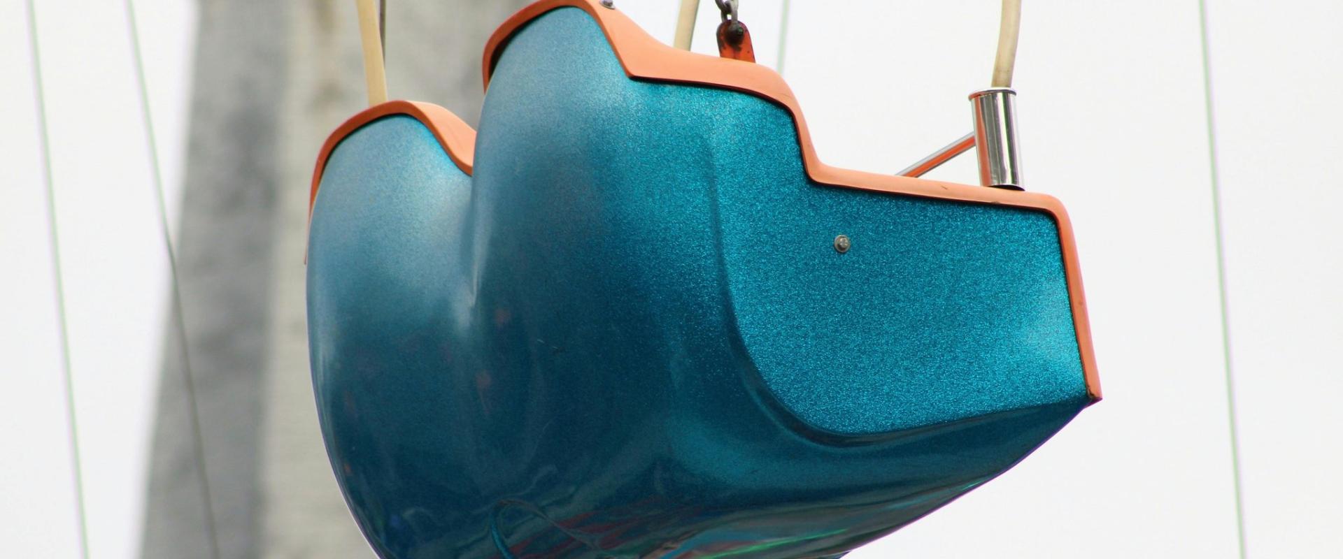 Close-up of a colorful swing ride at a Dutch amusement park, focusing on vibrant design.