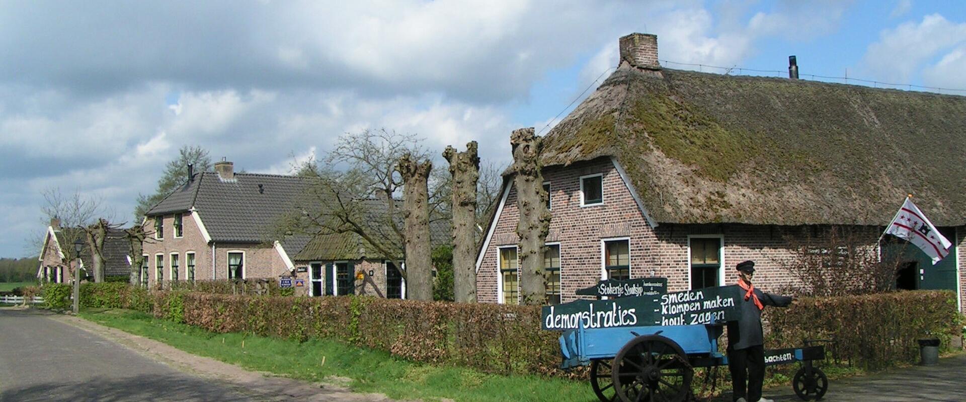 Thatched farmhouses and a horse cart in the museum village of Orvelte