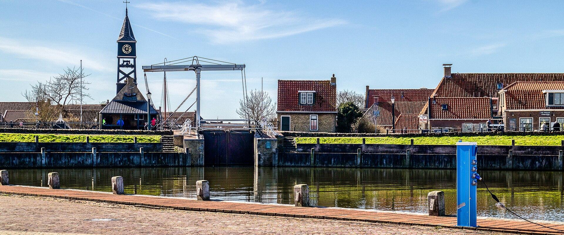 Hindeloopen harbour with the church tower and old Frisian houses