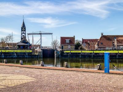 Hindeloopen harbour with the church tower and old Frisian houses