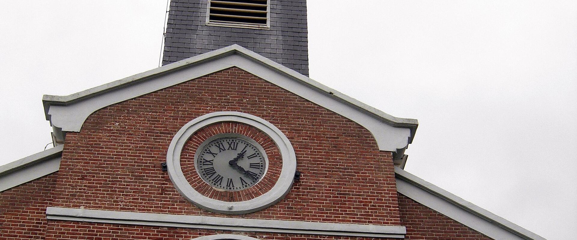 Red-brick village church with a white clock tower on Schiermonnikoog