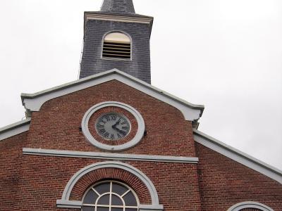 Red-brick village church with a white clock tower on Schiermonnikoog