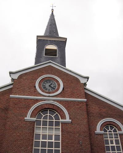 Red-brick village church with a white clock tower on Schiermonnikoog