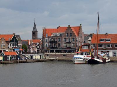 The harbour front of Volendam with its church tower and traditional houses