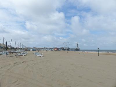 The wide Noorderstrand beach at Scheveningen with the pier and Ferris wheel