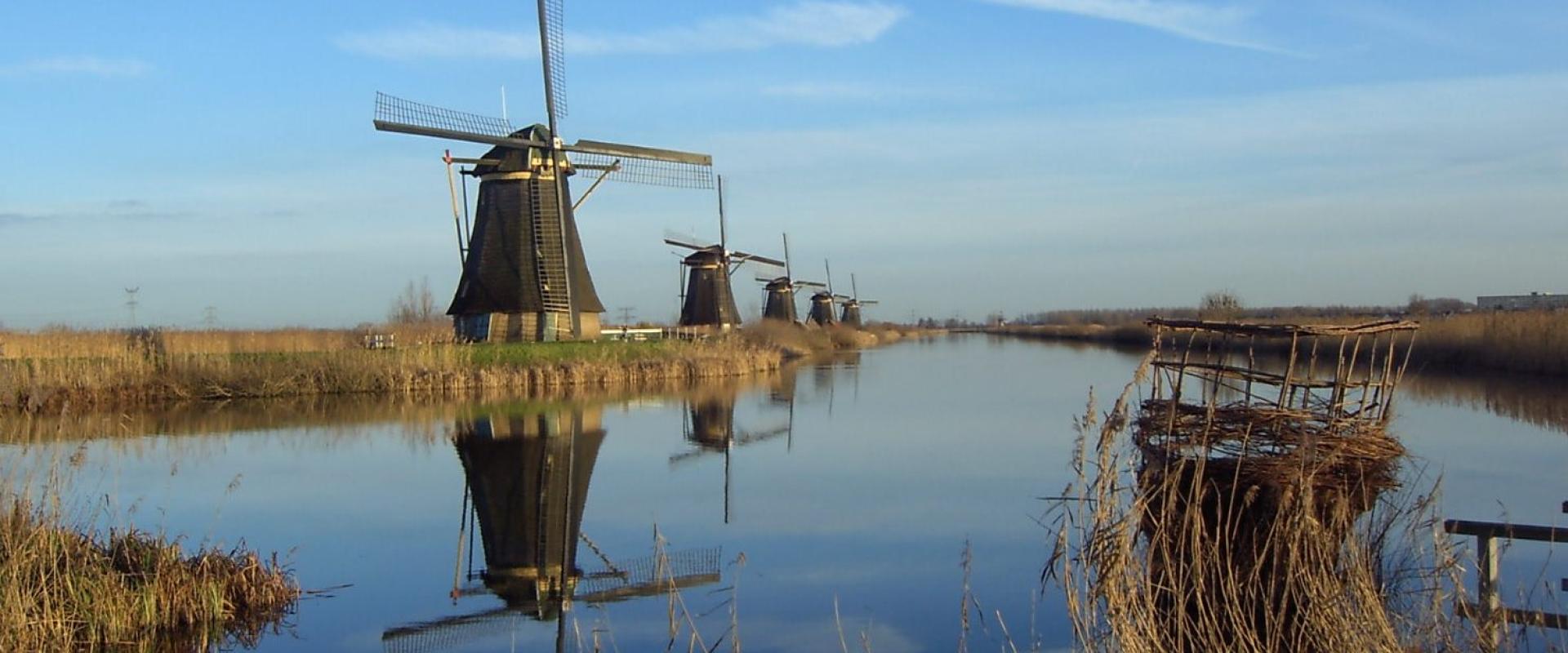 The windmills of Kinderdijk reflected in the polder water