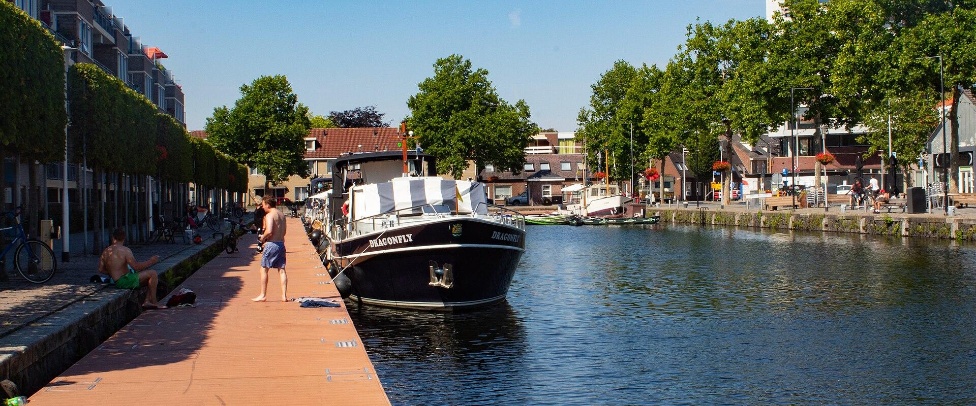 Moored boats along the quay of the Piushaven in Tilburg in summer