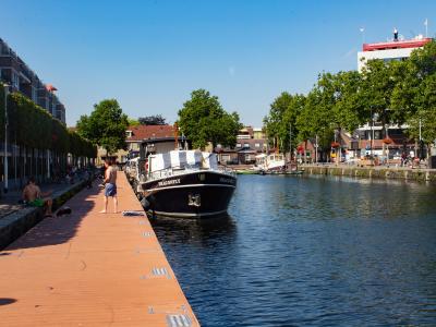 Moored boats along the quay of the Piushaven in Tilburg in summer