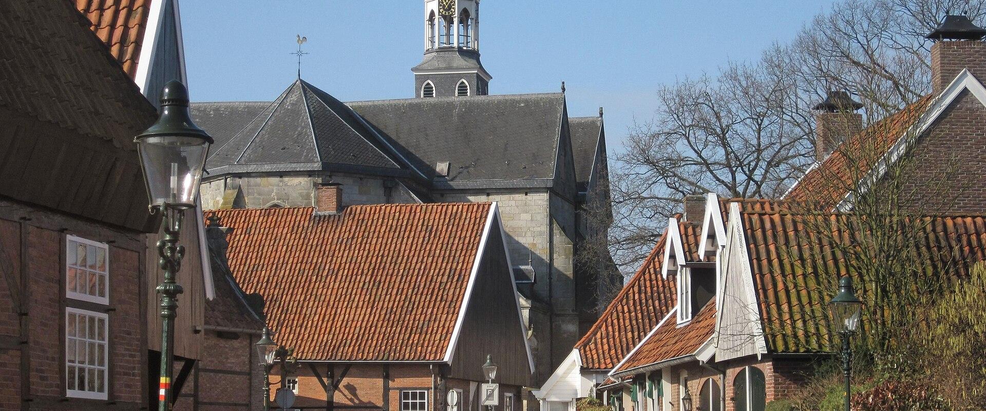 A street of brick houses leading to the church in Ootmarsum, Twente