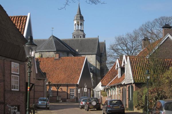 A street of brick houses leading to the church in Ootmarsum, Twente