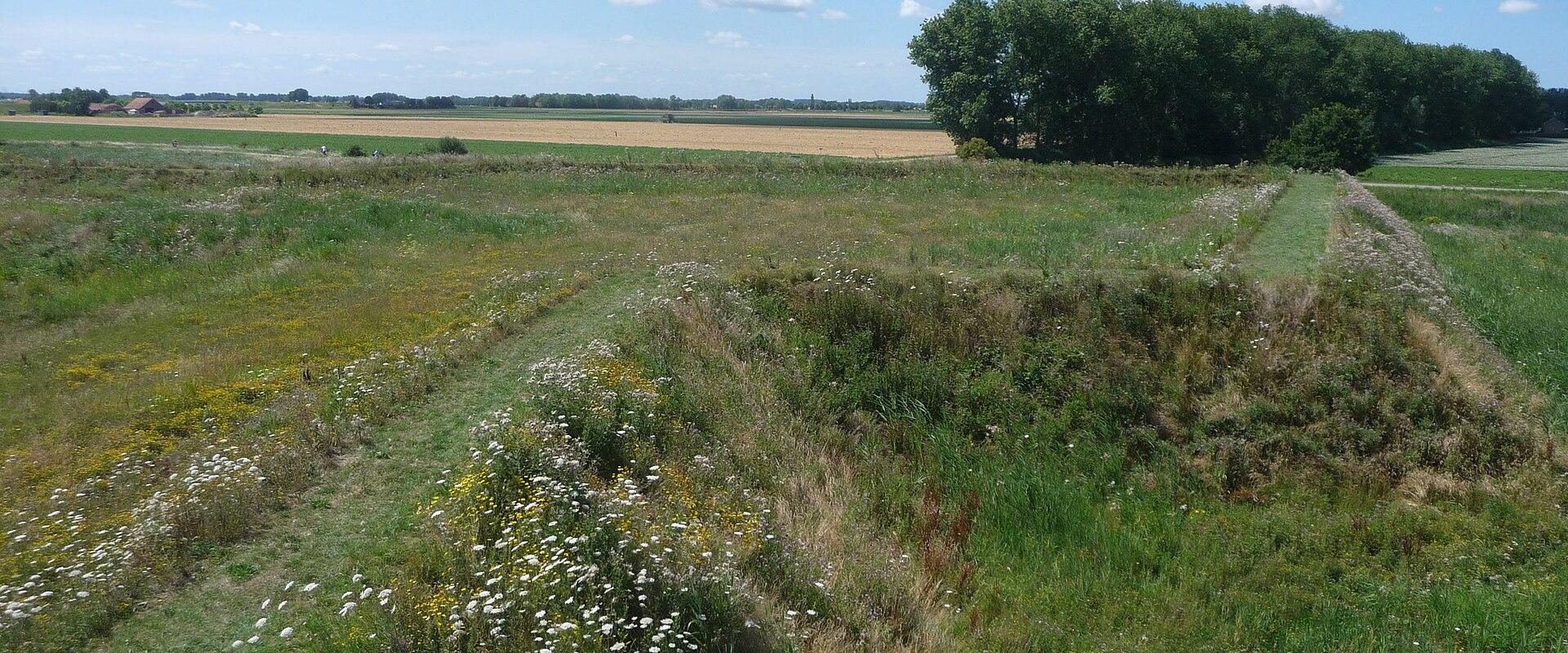 Grassy earthen ramparts of Fort Henricus near Steenbergen