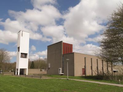 The modernist church tower and low brick buildings of Nagele, the 1950s planned village in the Noordoostpolder.