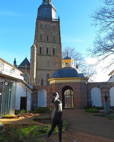 The Stedelijk Museum Zutphen courtyard with the Walburgiskerk tower