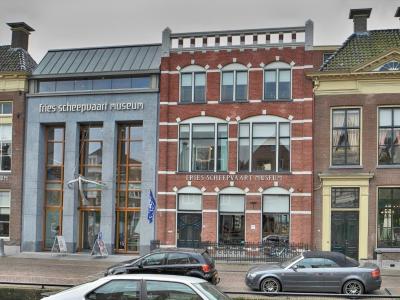 The canal-side houses of the Fries Scheepvaart Museum on Kleinzand in Sneek