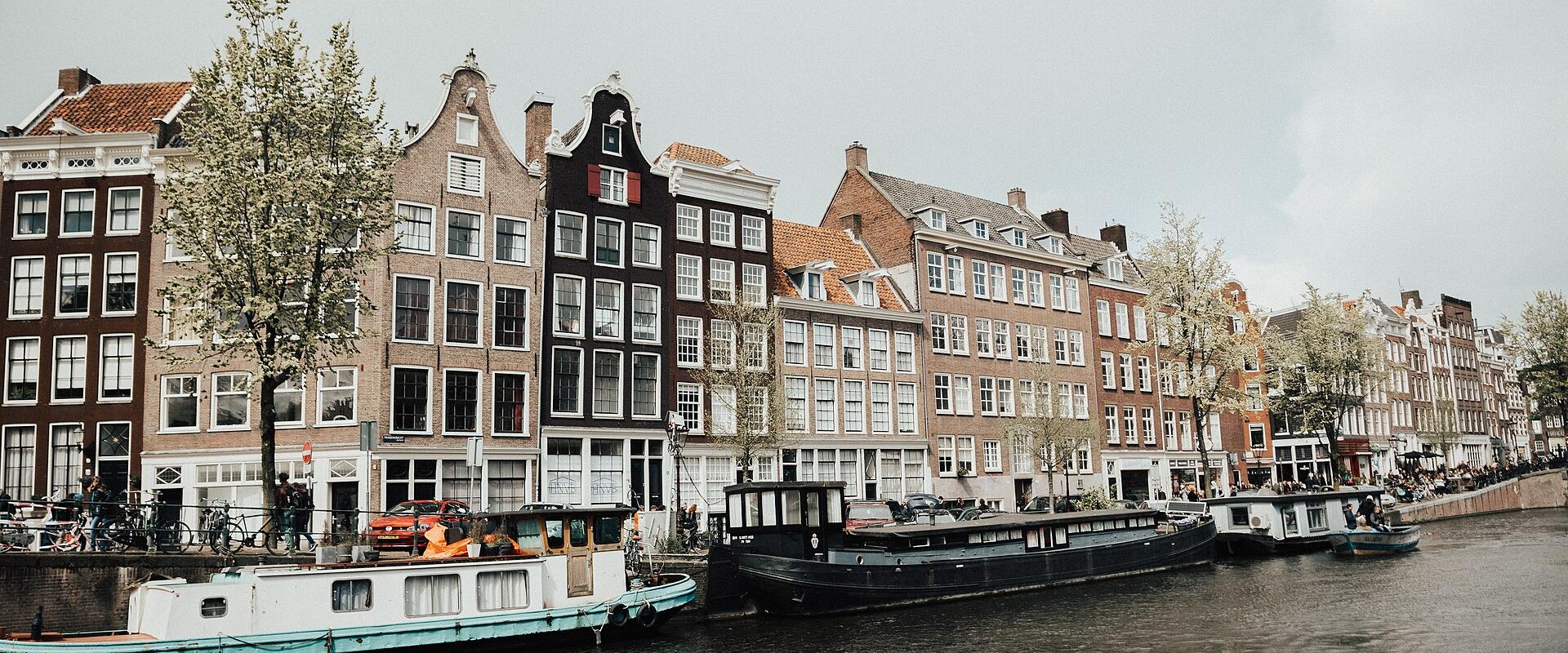 Canal houses and houseboats along an Amsterdam canal