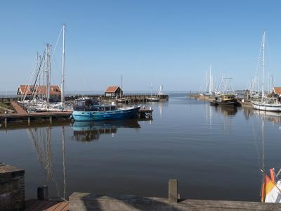 Boats in the harbour of Hindeloopen on a calm day