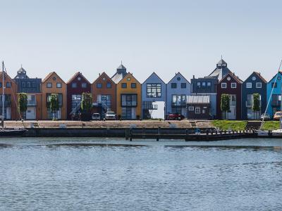 Colourful waterfront houses along the harbour of Stavoren