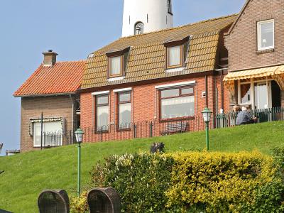 The white lighthouse of Urk above the old fishing village