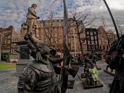 The Night Watch sculptures facing Rembrandt's statue on Rembrandtplein