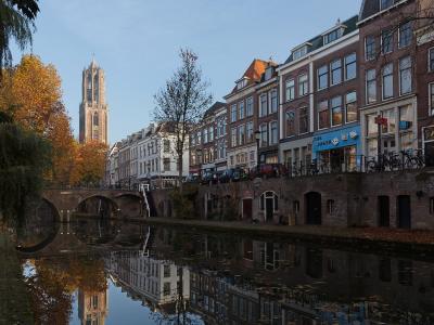The Oudegracht canal and the Dom Tower in Utrecht in autumn
