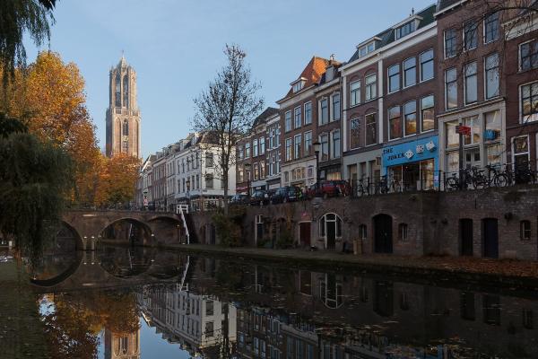 The Oudegracht canal and the Dom Tower in Utrecht in autumn
